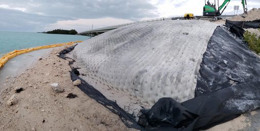 A large white object sitting on top of a beach.